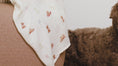 Load and play video in Gallery viewer, Organic Cotton & Bamboo Muslin Swaddle Blanket in Doodle
